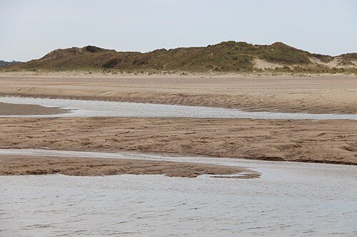 De geul aan de Nederlandse kant bij Cadzand. Hierdoor loopt de zee bij hoog tij het gebied in.